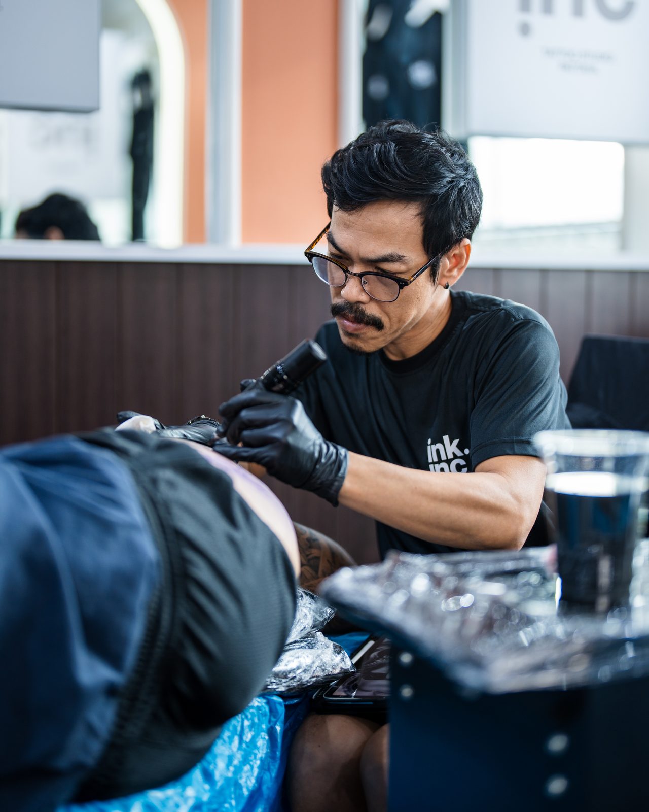 Ink.Inc tattoo artist at work